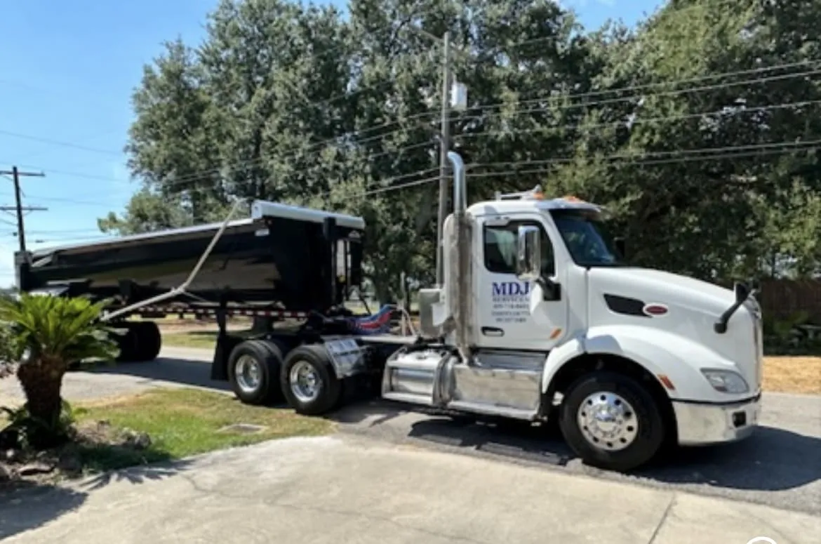 MDJ Services end dump truck for aggregate hauling in Port Arthur, TX
